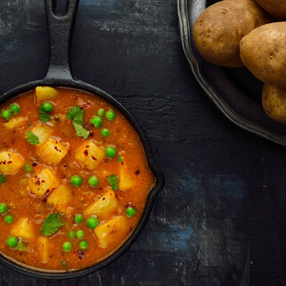 Curried Potatoes and Baby Peas (Tariwale Aloo)