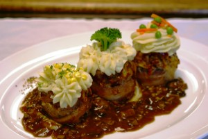 Meatloaf cupcakes with whipped potatoes. roasted corn and dark pan mushroom gravy Meatloaf cupcakes with whipped potatoes. roasted corn and dark pan mushroom gravy